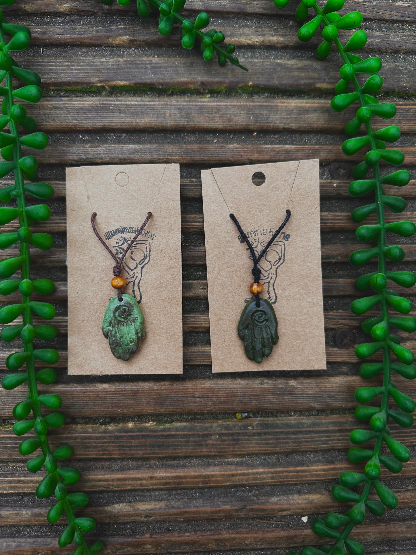 Green healing hand pendant necklace.
