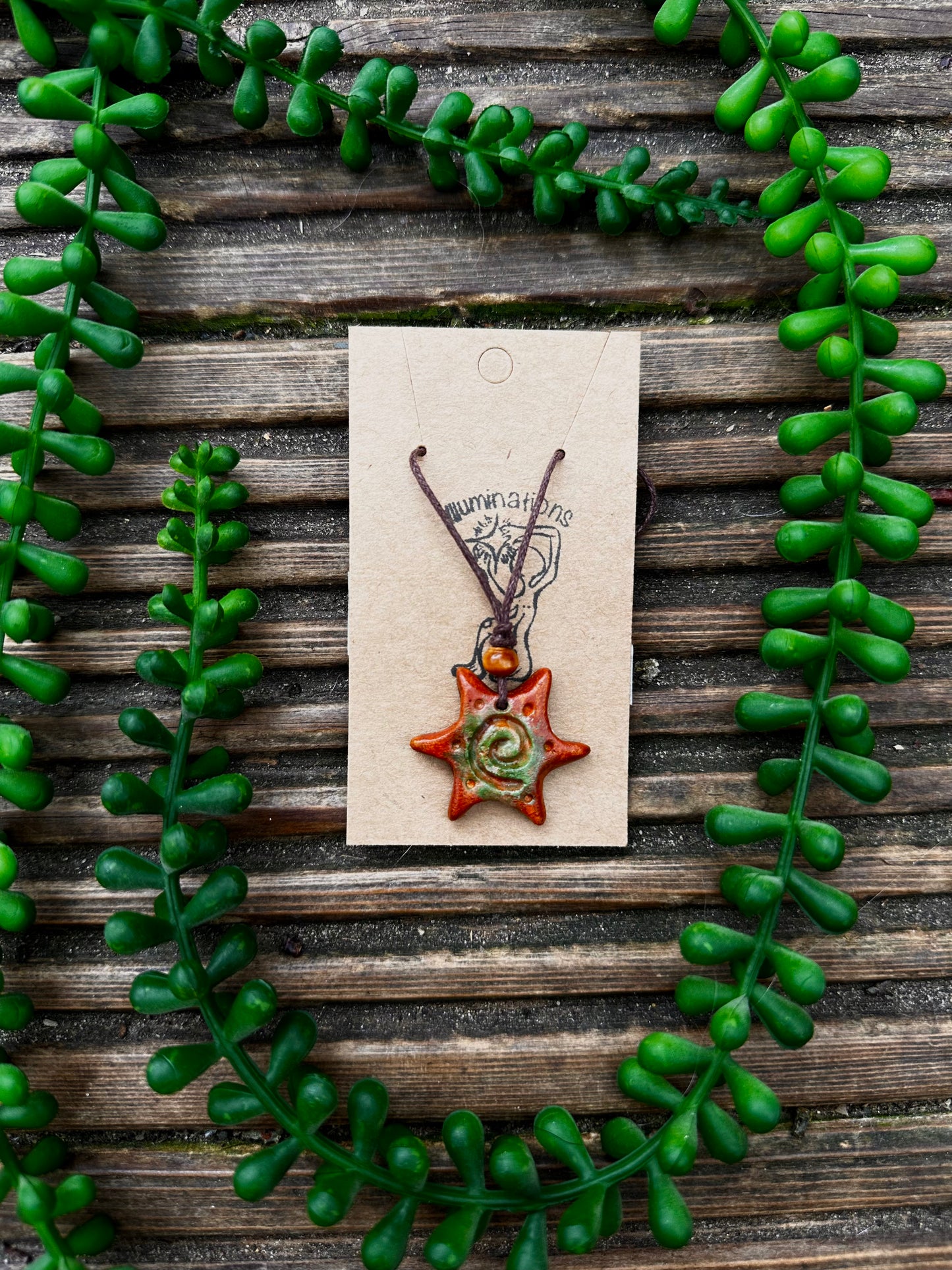 Spiral sun pendant necklace.
