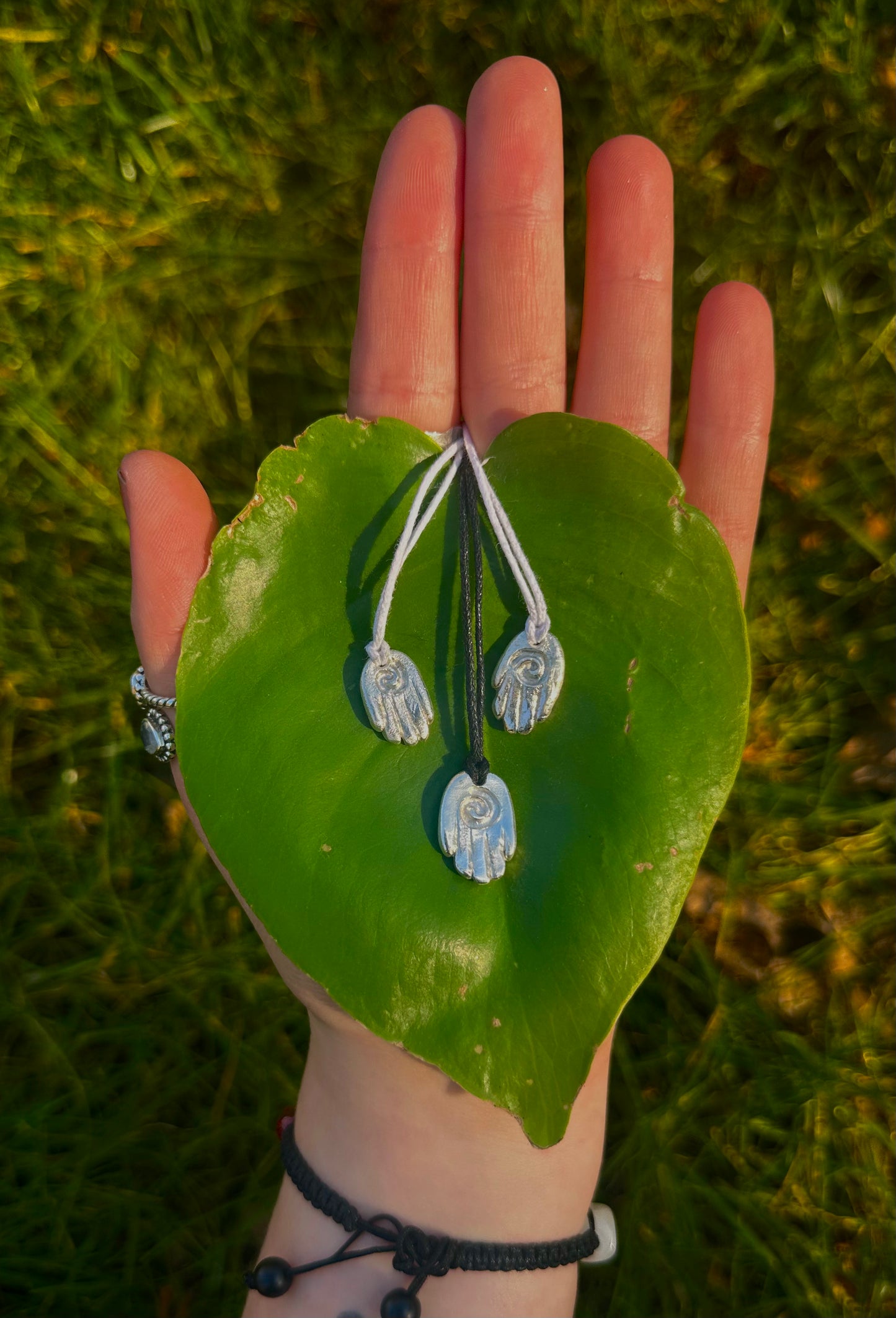 Sterling silver healing hand pendant necklace.