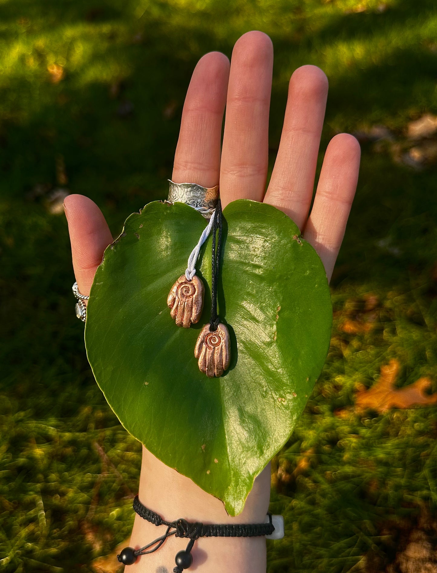 Copper healing hand pendant necklace.
