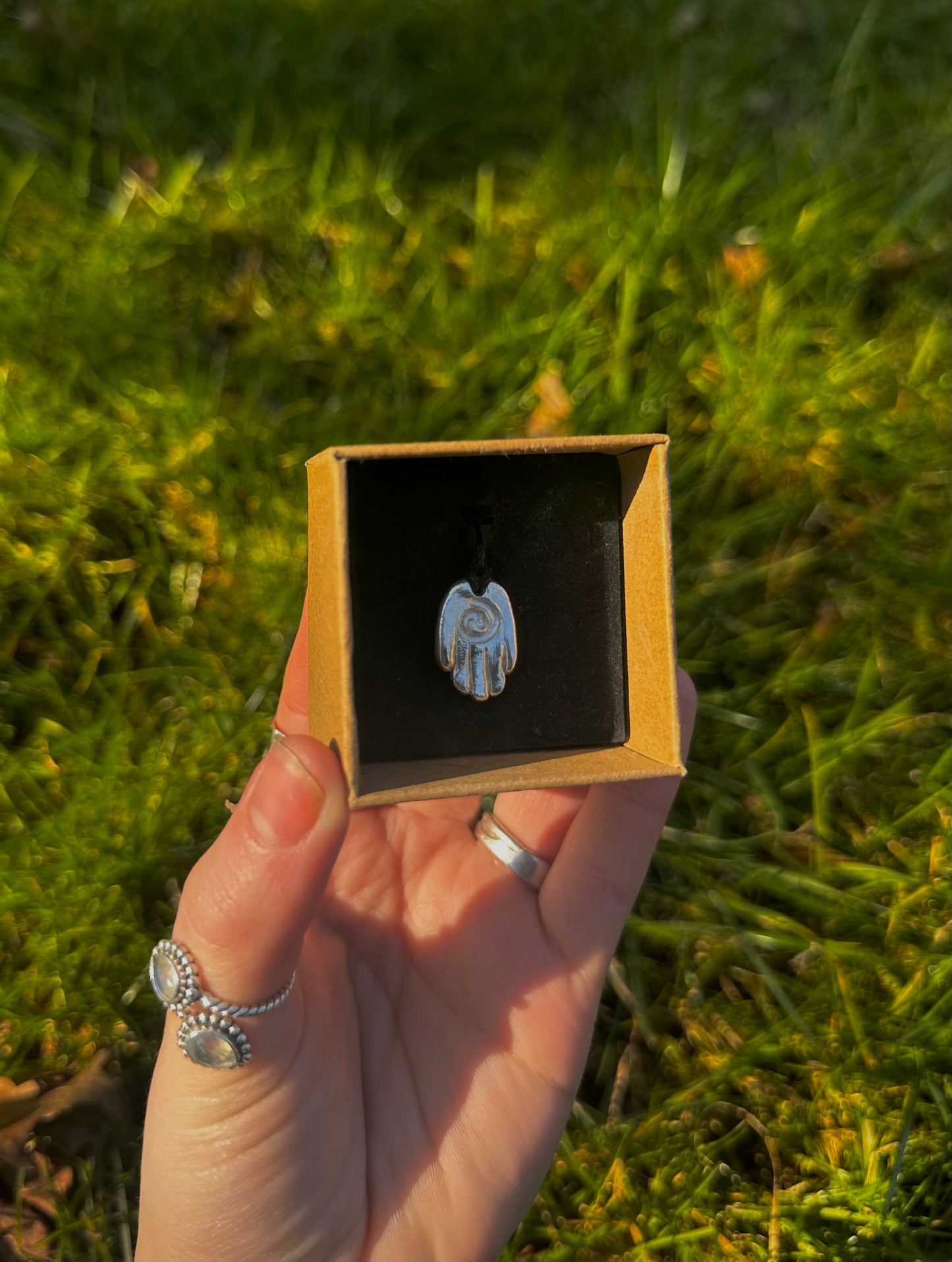 Sterling silver healing hand pendant necklace.