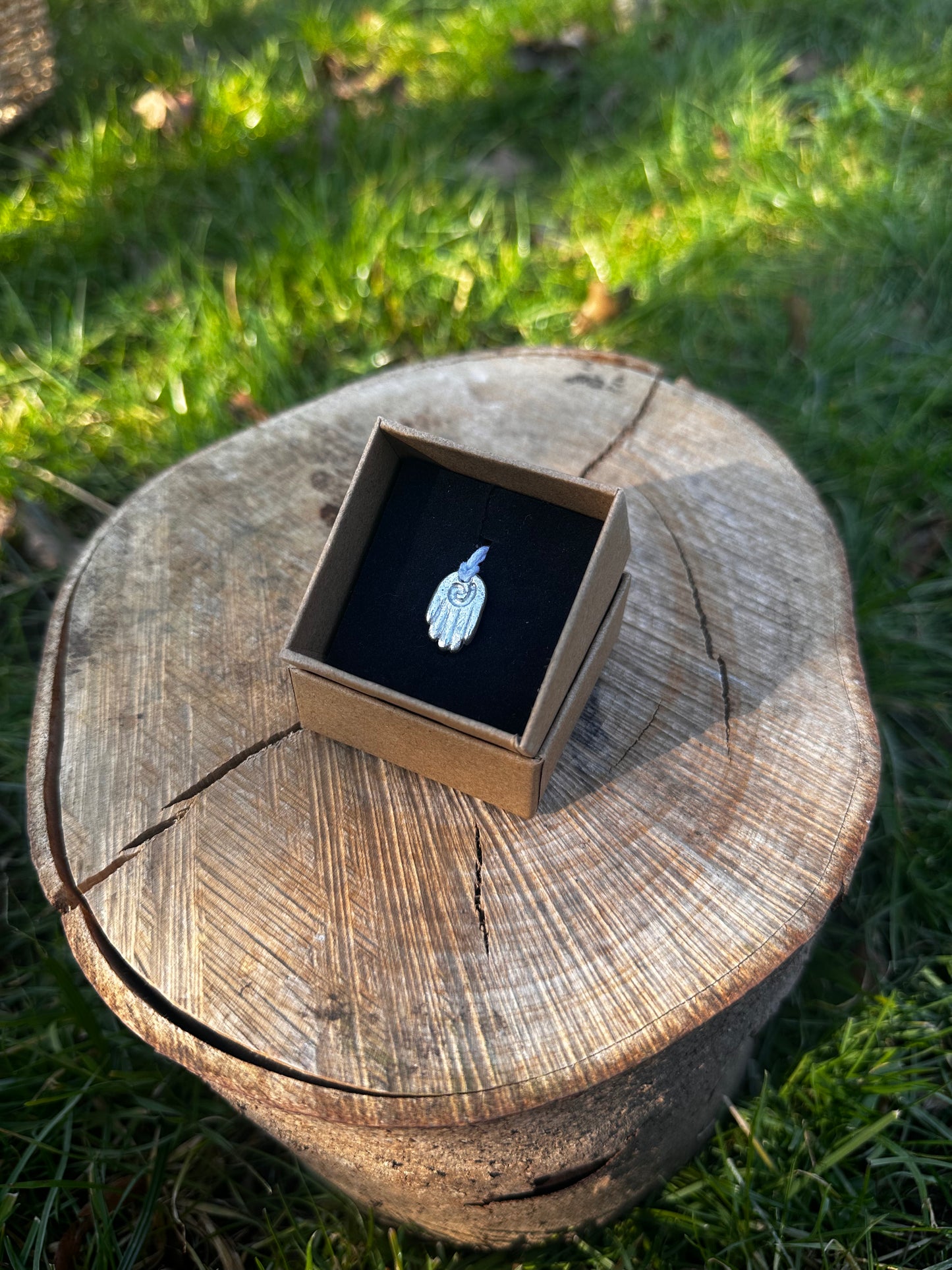 Sterling silver healing hand pendant necklace.