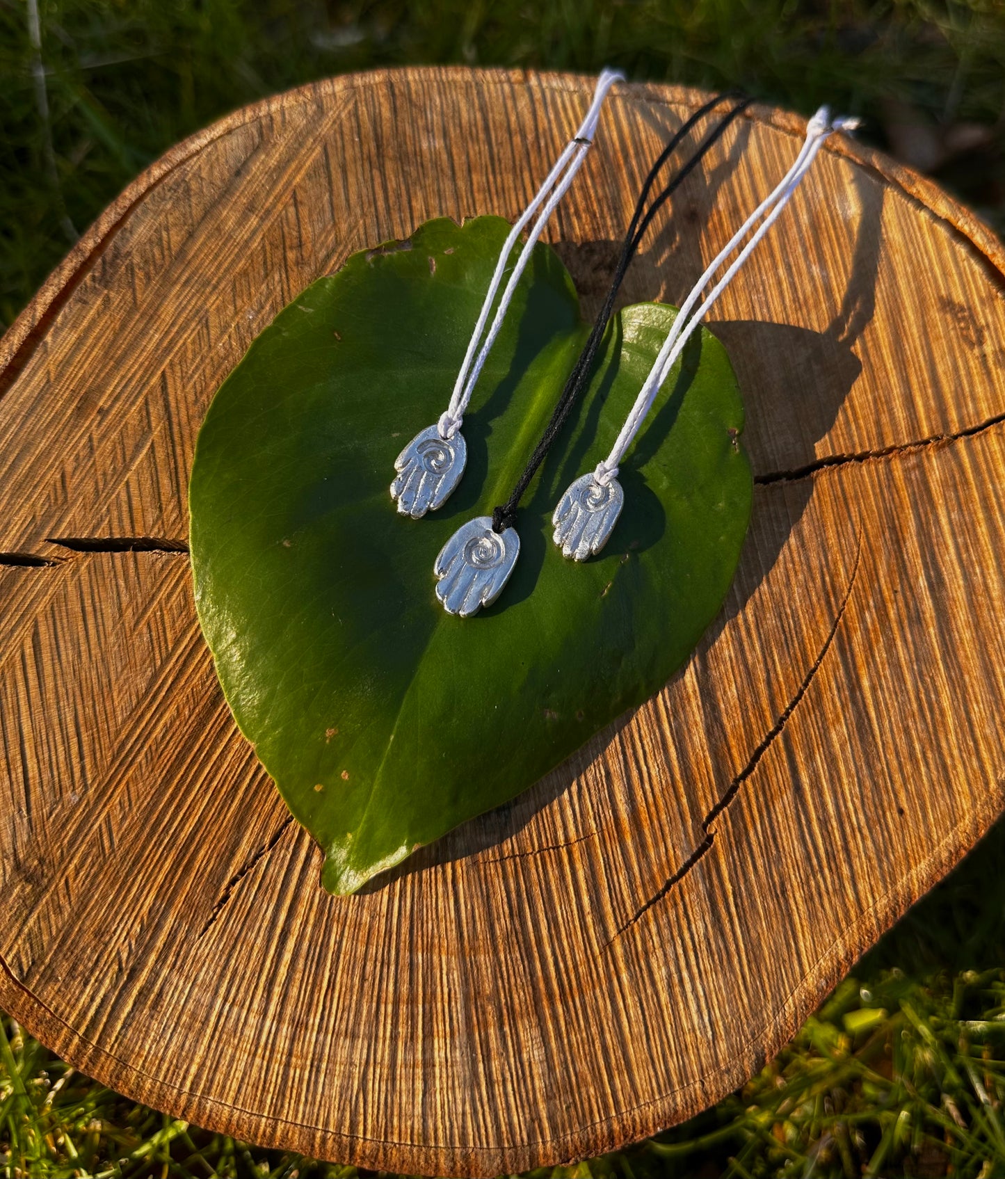 Sterling silver healing hand pendant necklace.