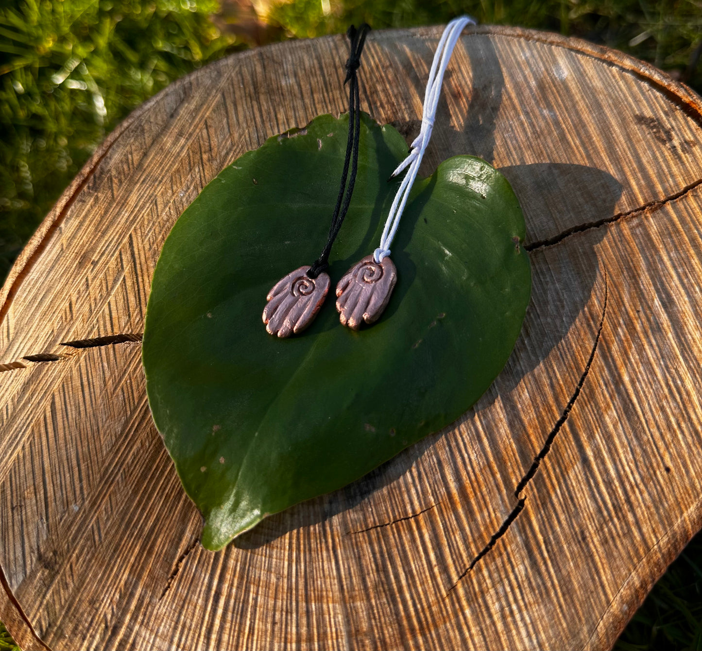 Copper healing hand pendant necklace.