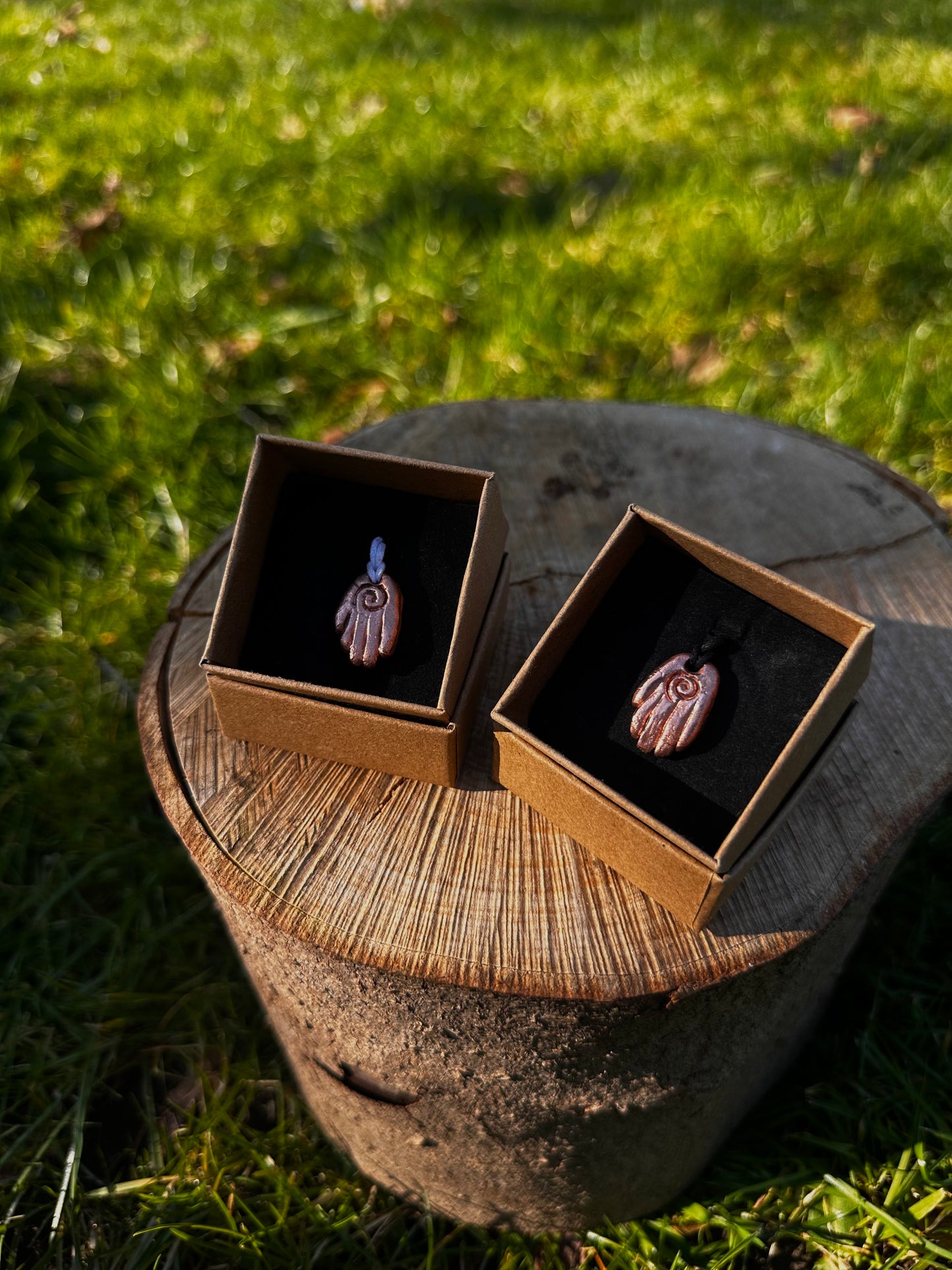 Copper healing hand pendant necklace.
