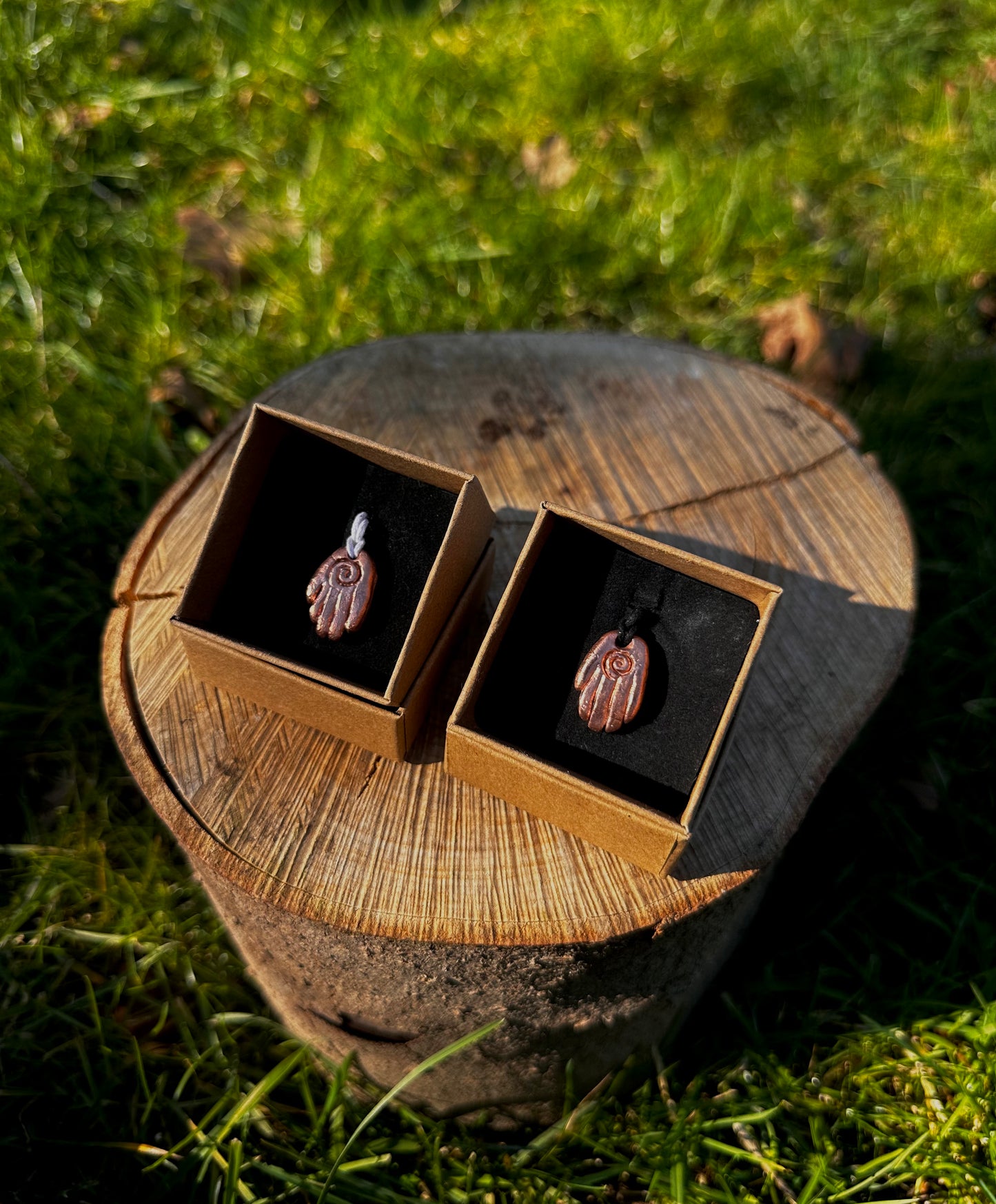 Copper healing hand pendant necklace.