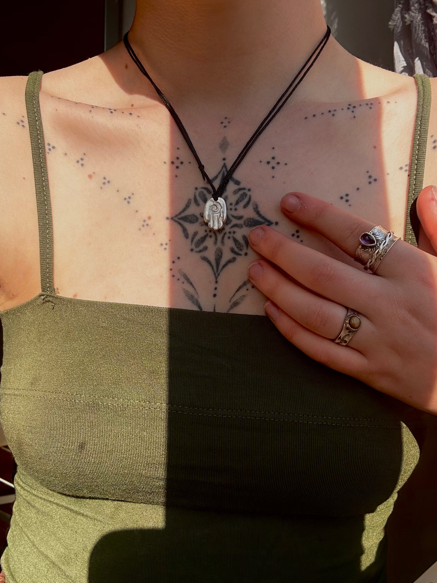 Sterling silver healing hand pendant necklace.