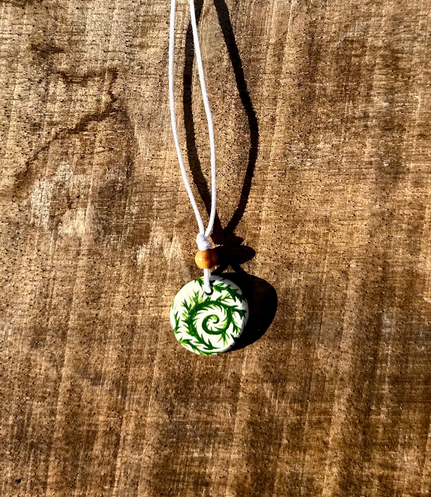 Leafy vine pendant necklace.
