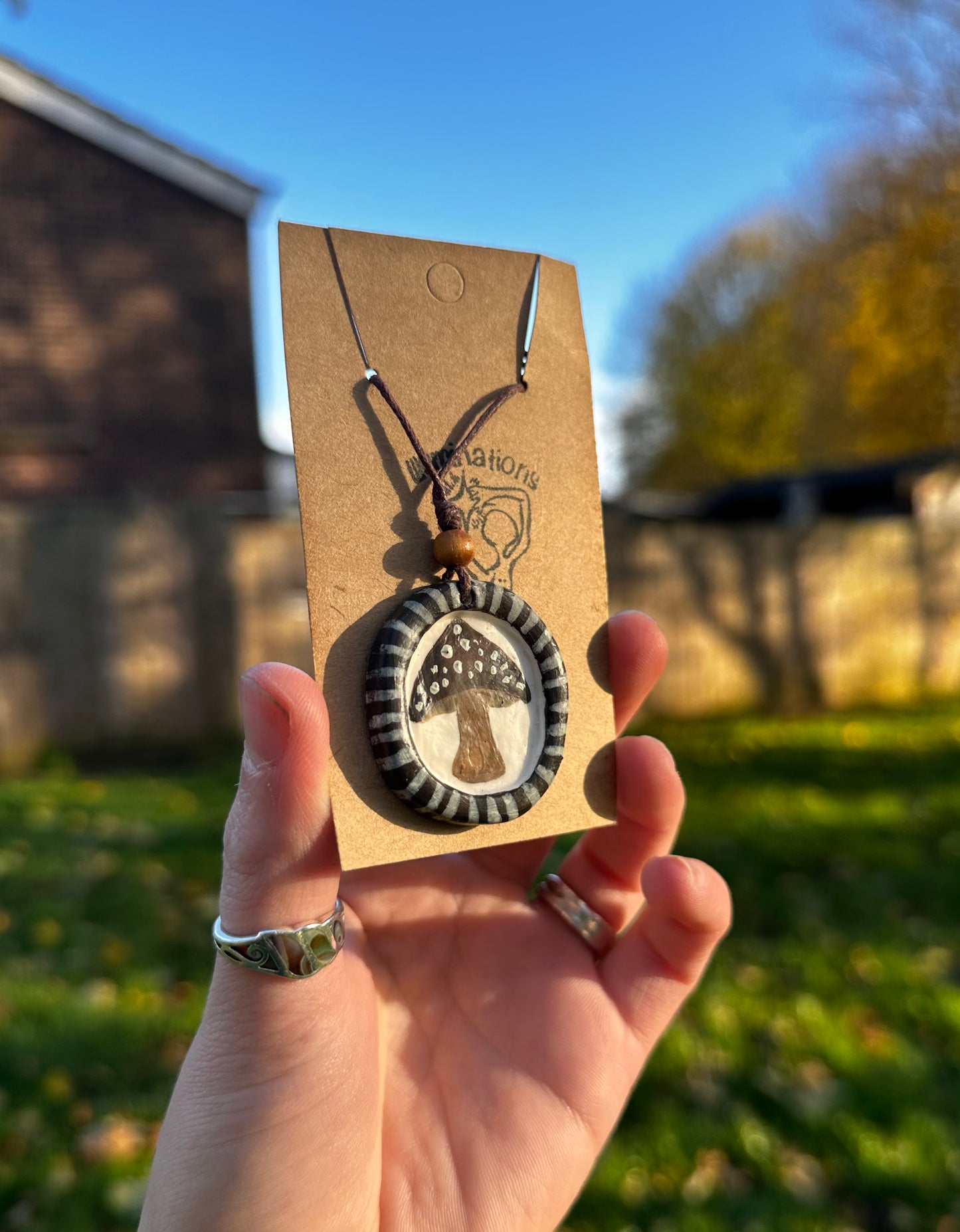 Framed mushroom pendant necklace.