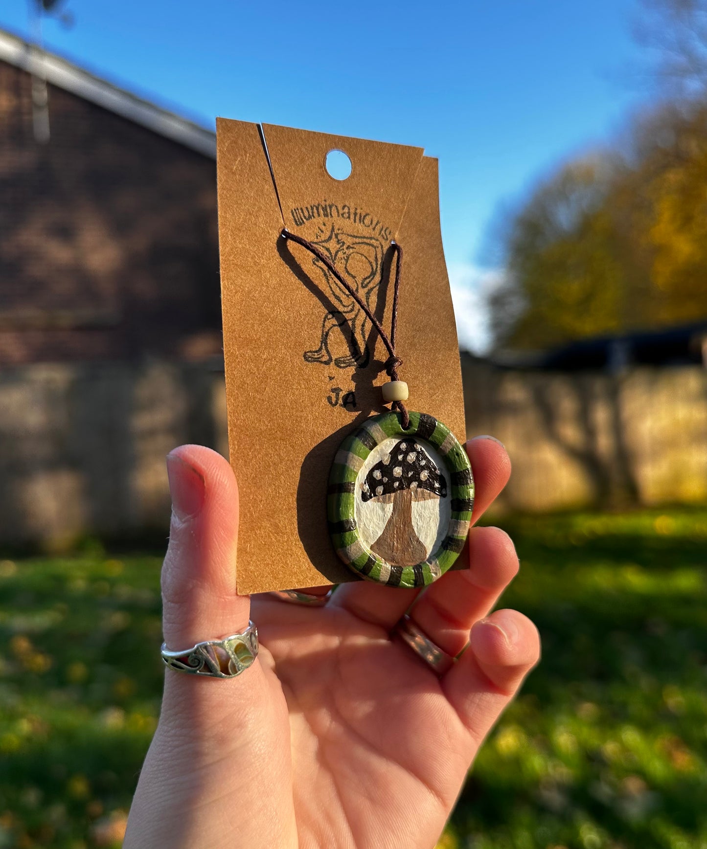 Framed mushroom pendant necklace.