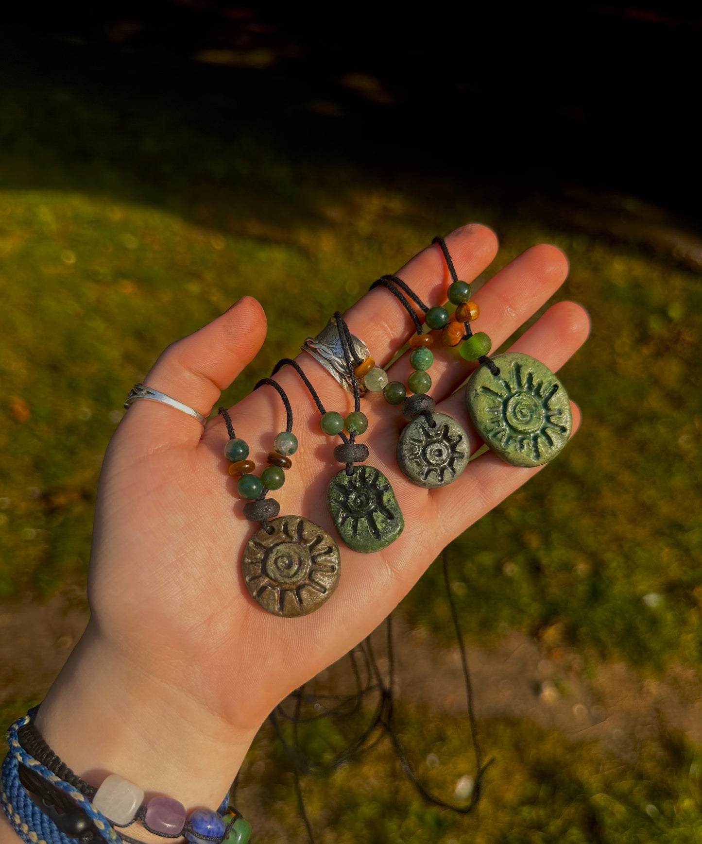 Crystal beaded hand painted pendant necklaces.