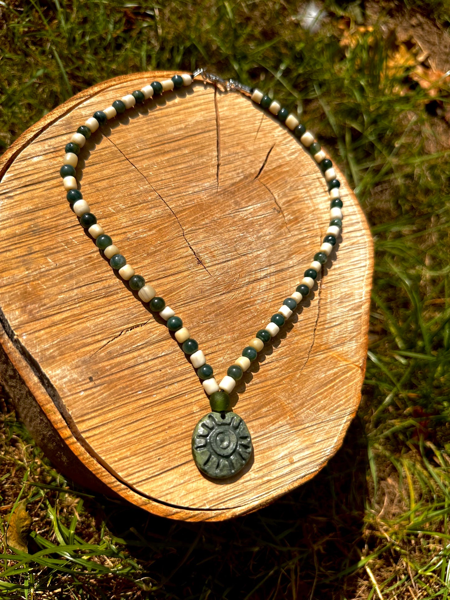 Fully beaded pendant necklace.