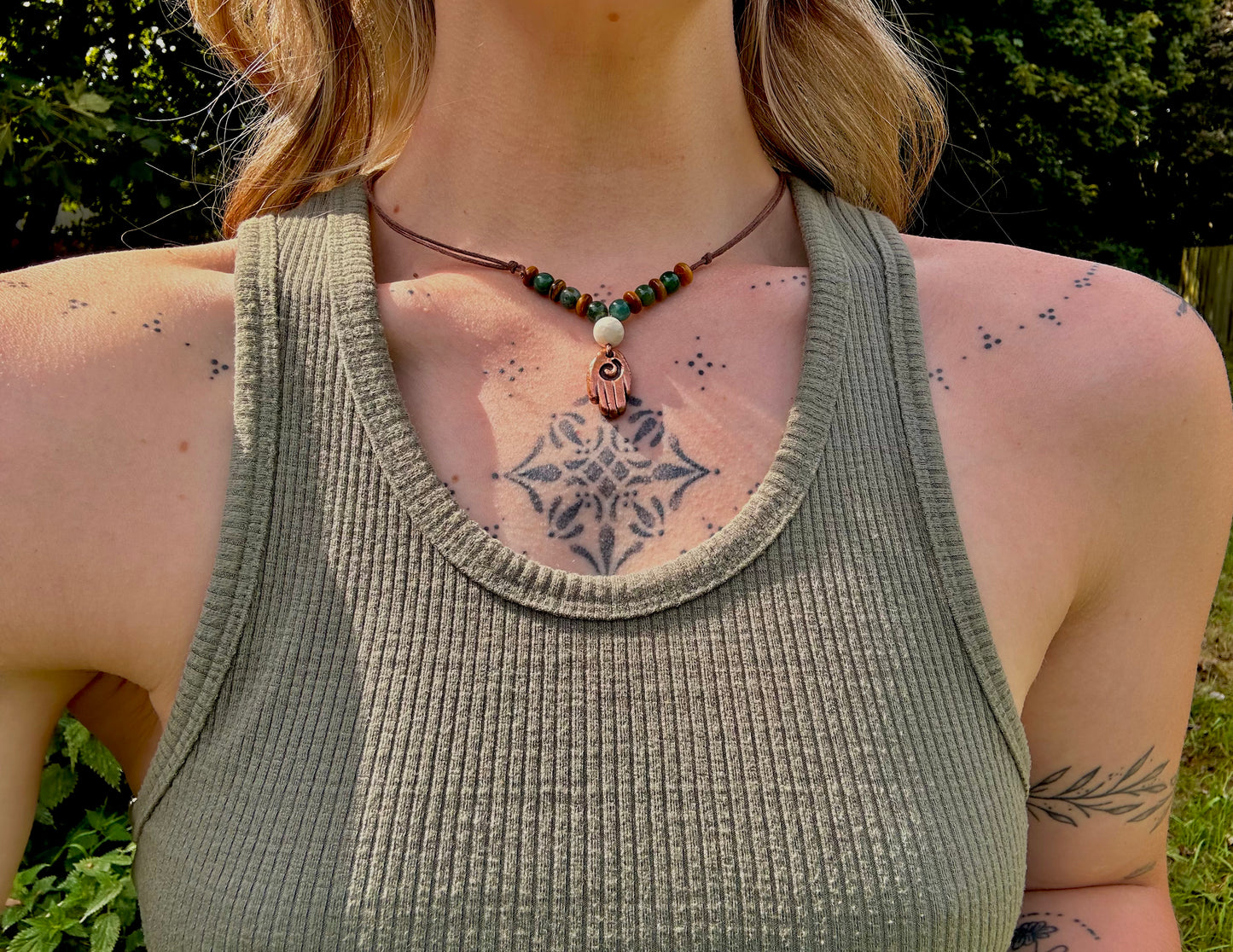Large Copper Healing Hand pendant necklace with crystal beads.