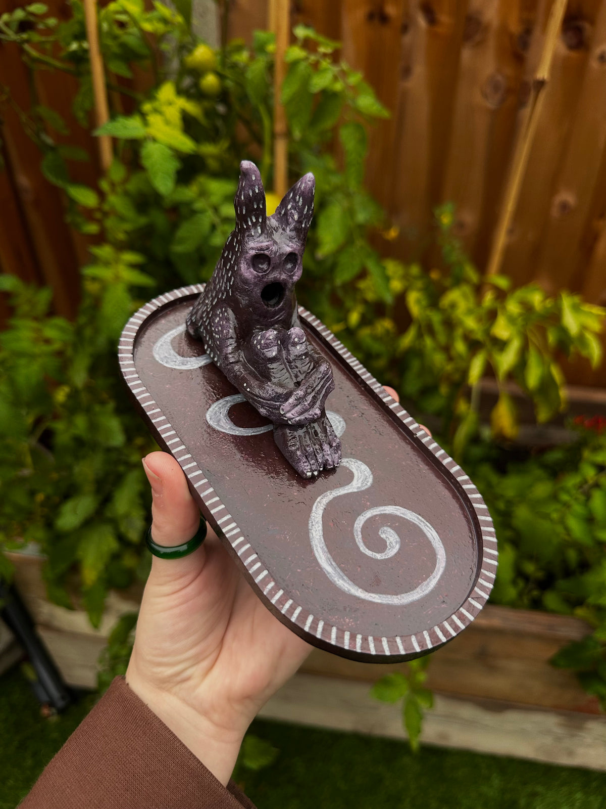 The pondering exhales, incense creature.