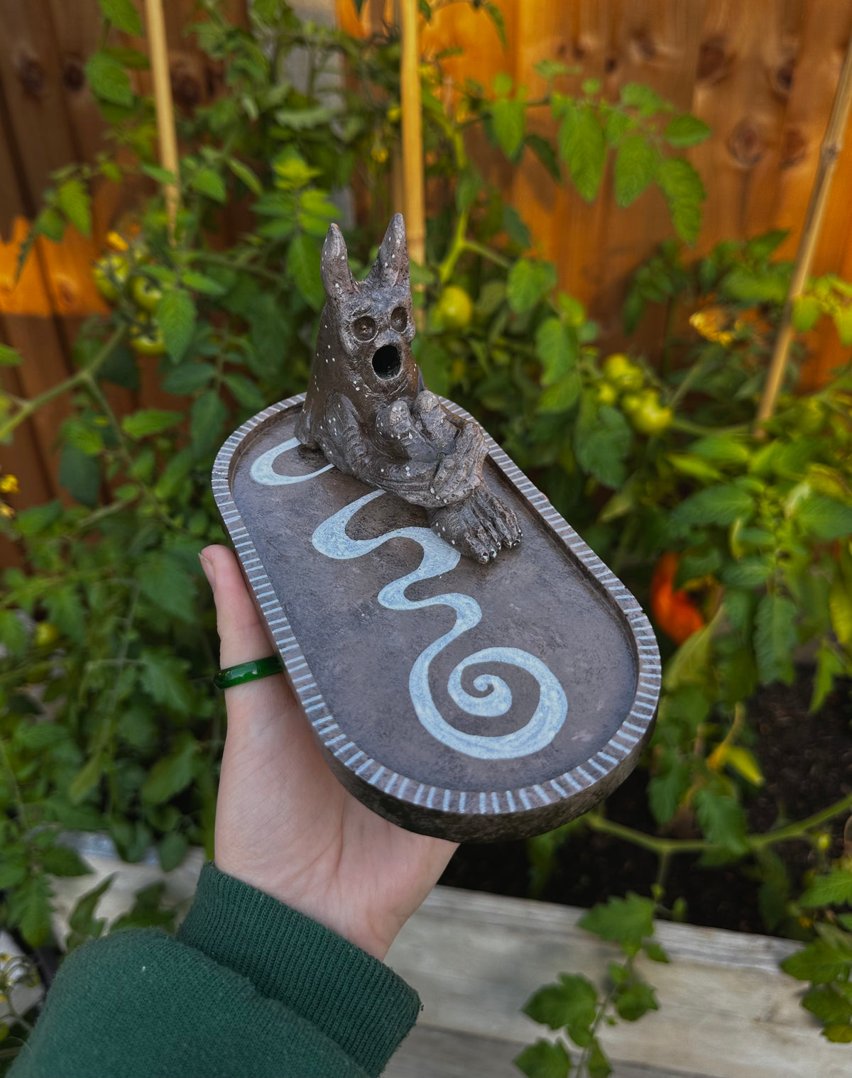 The pondering exhales, incense creature.