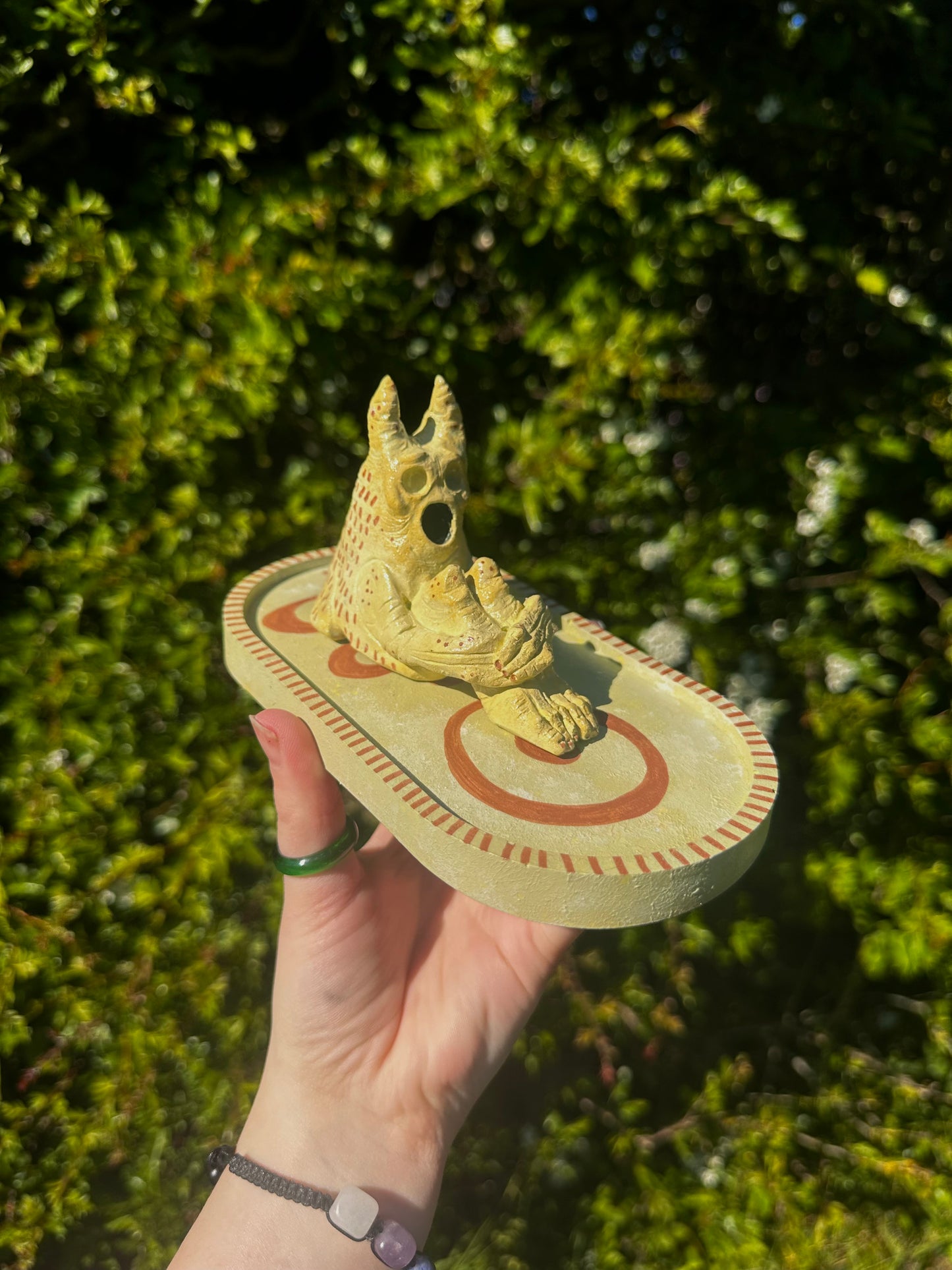 The pondering exhales, incense creature.