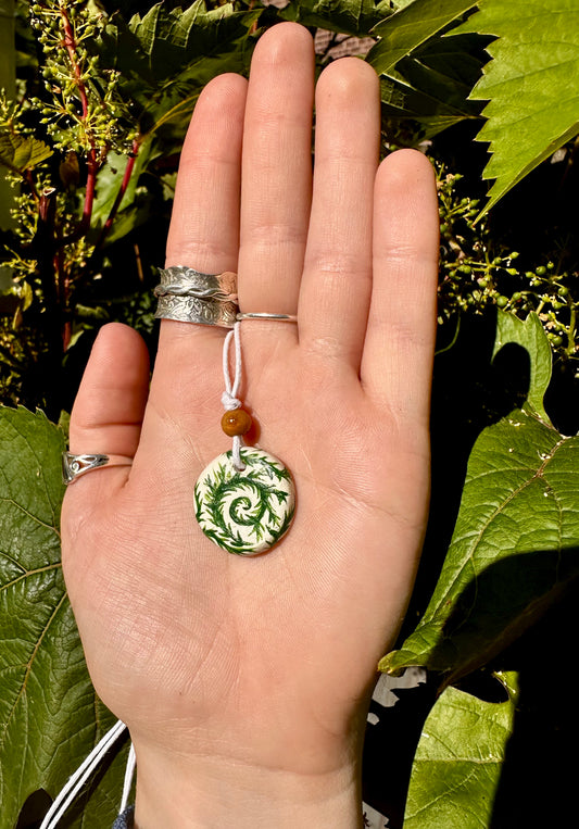 Leafy vine pendant necklace.