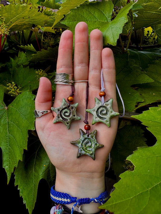 Spiral sun pendant necklace.