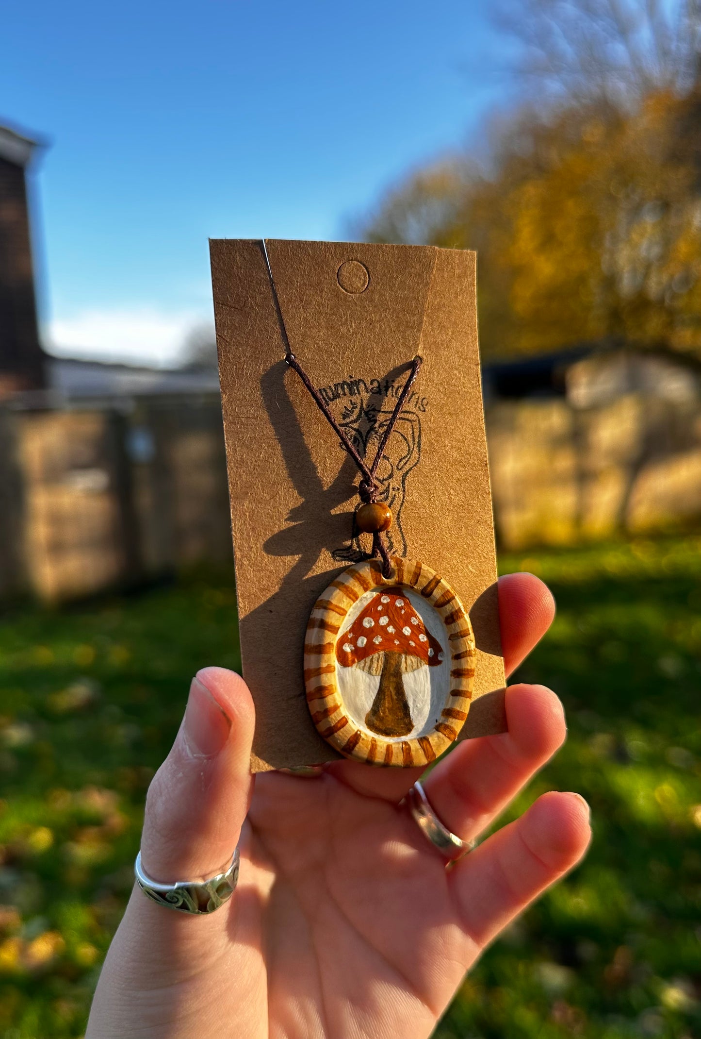 Framed mushroom pendant necklace.