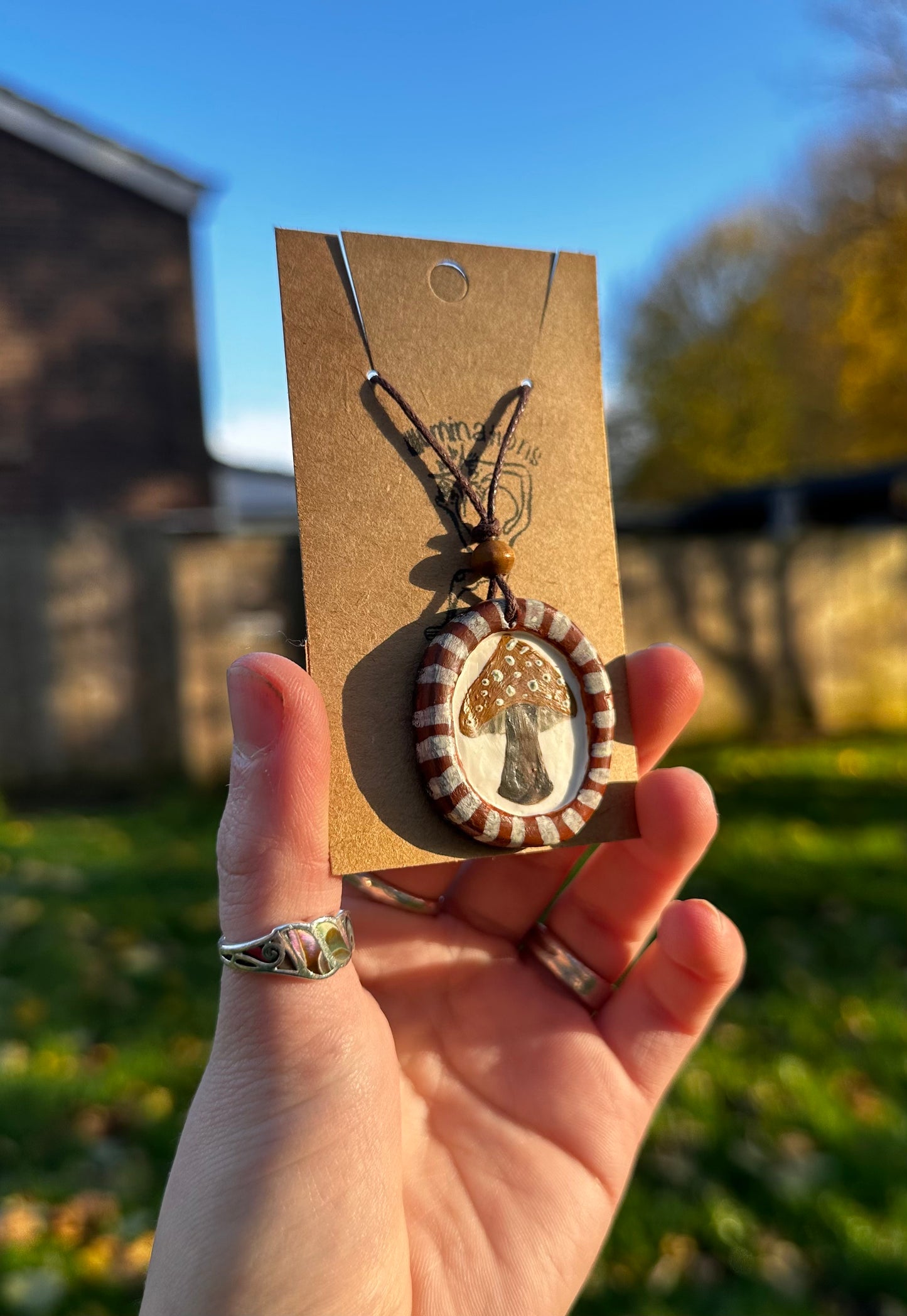 Framed mushroom pendant necklace.