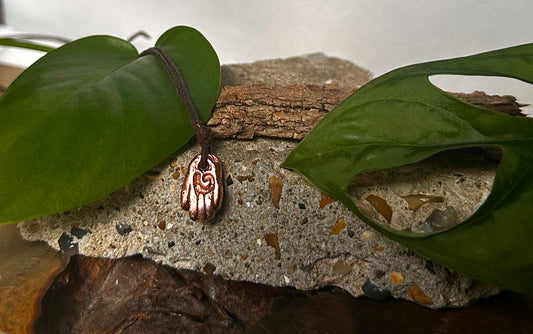 Small Copper healing hand pendant necklace.