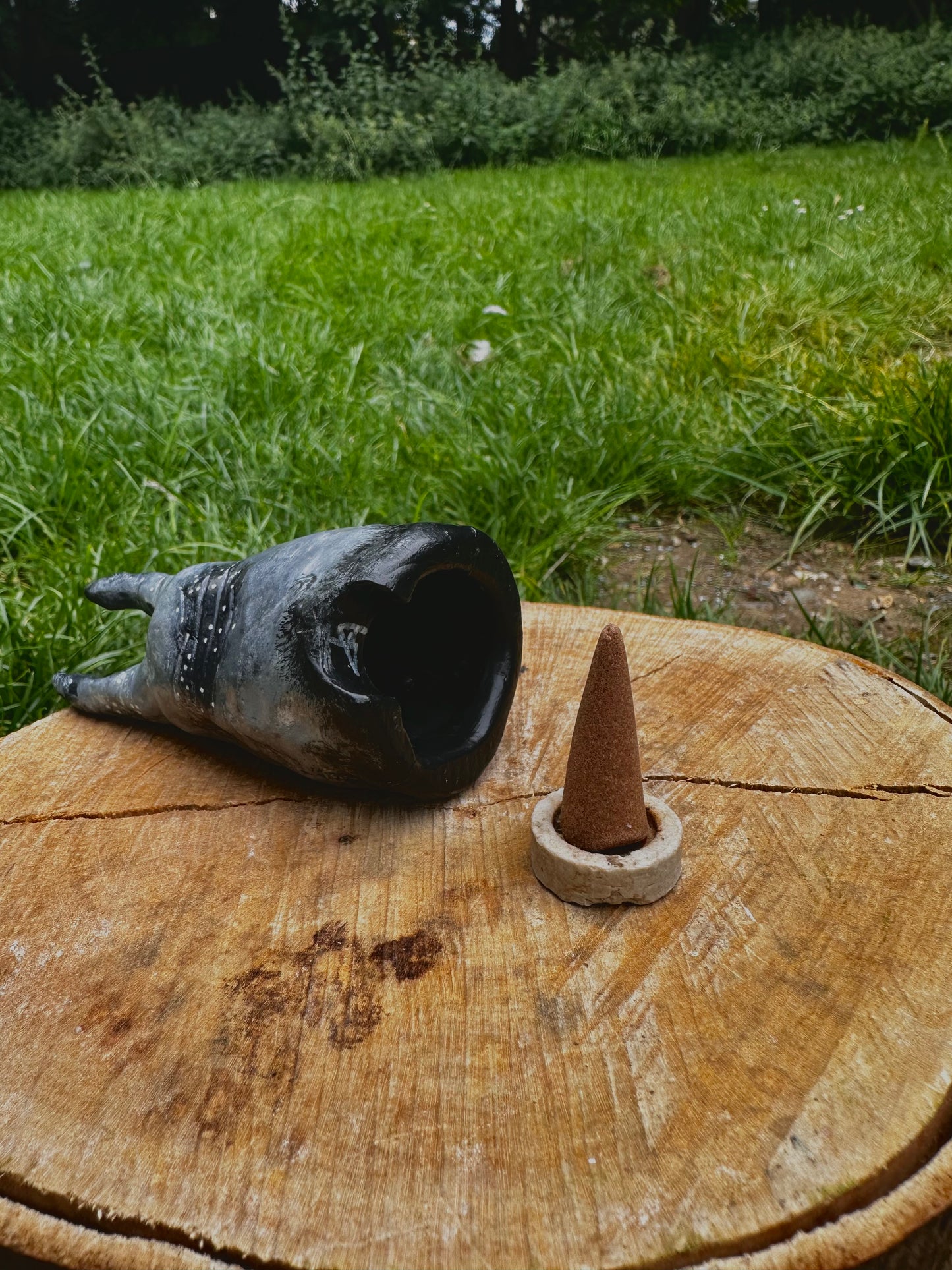 The exhales incense cone cover.