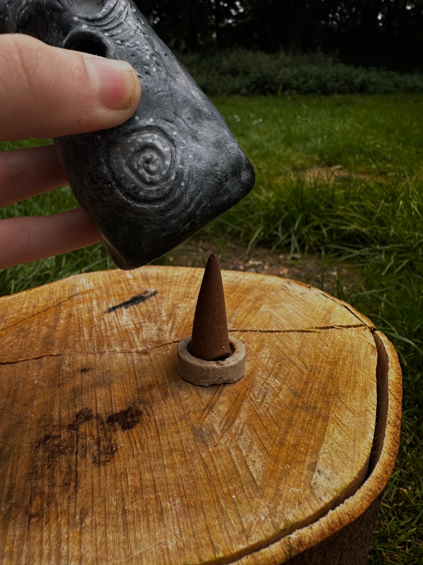 The exhales incense cone cover.