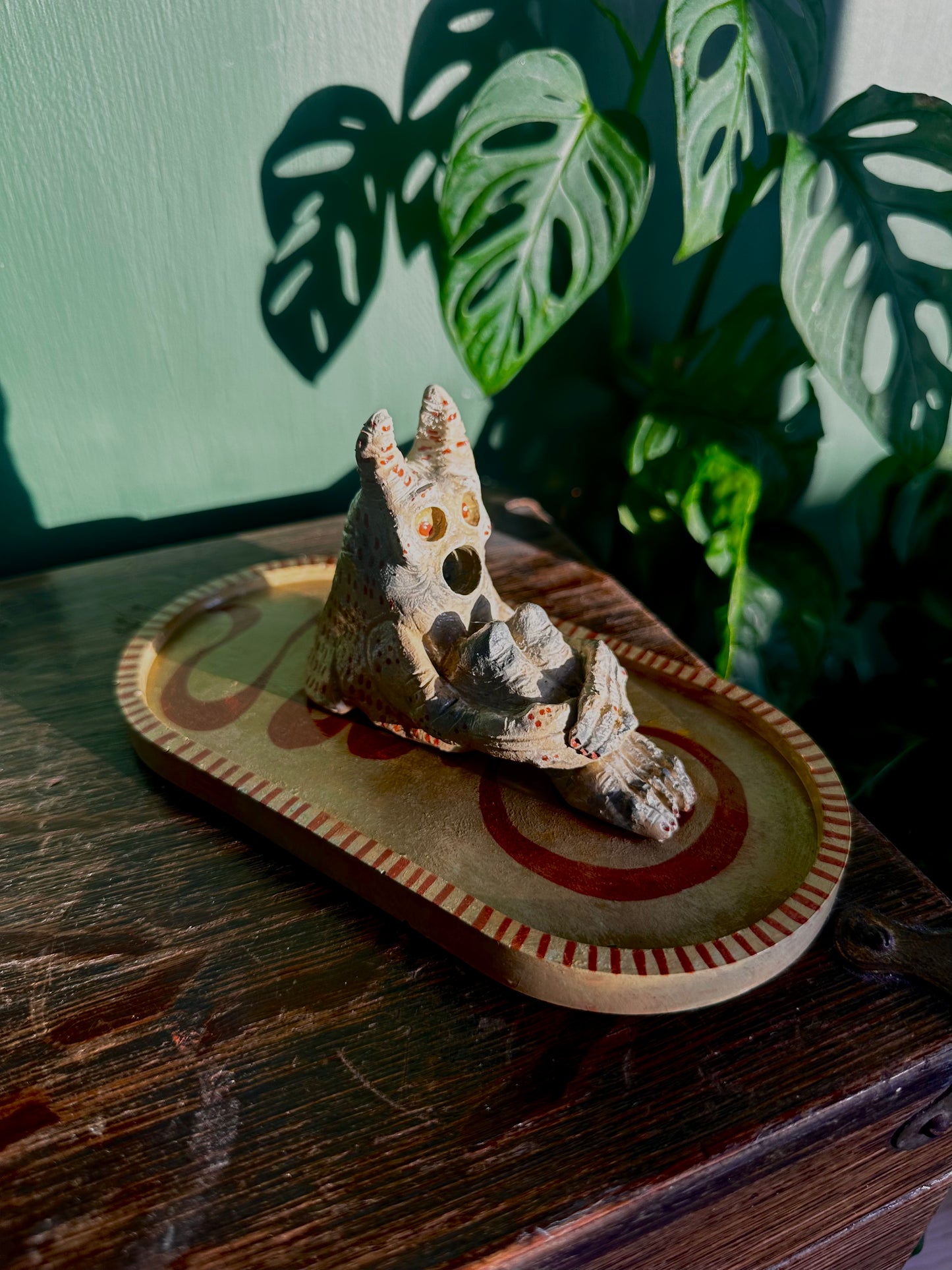 The pondering exhales, incense creature.