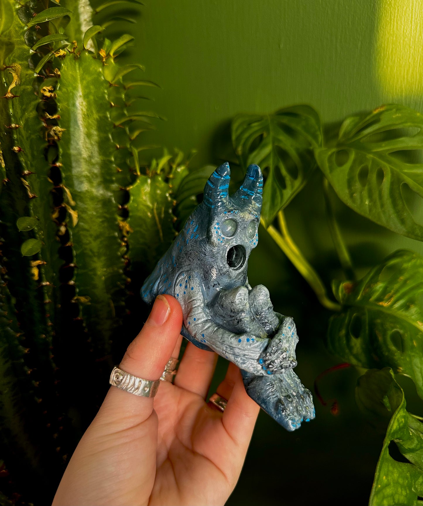 The pondering exhales, incense creature.