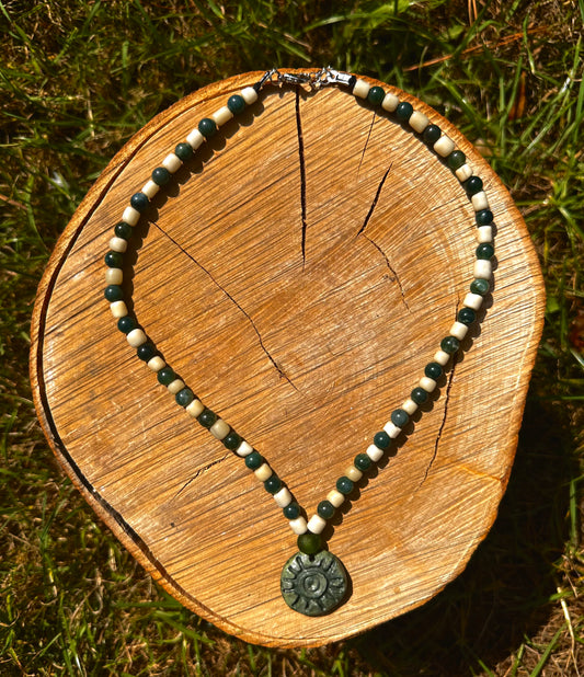 Fully beaded pendant necklace.