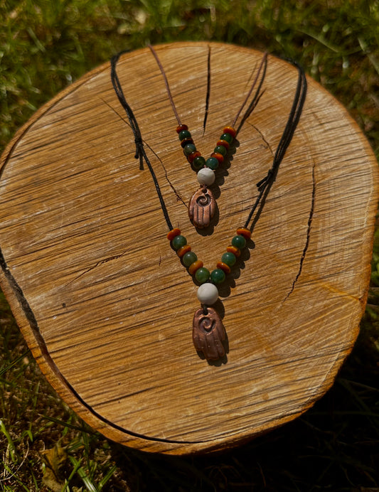 Large Copper Healing Hand pendant necklace with crystal beads.