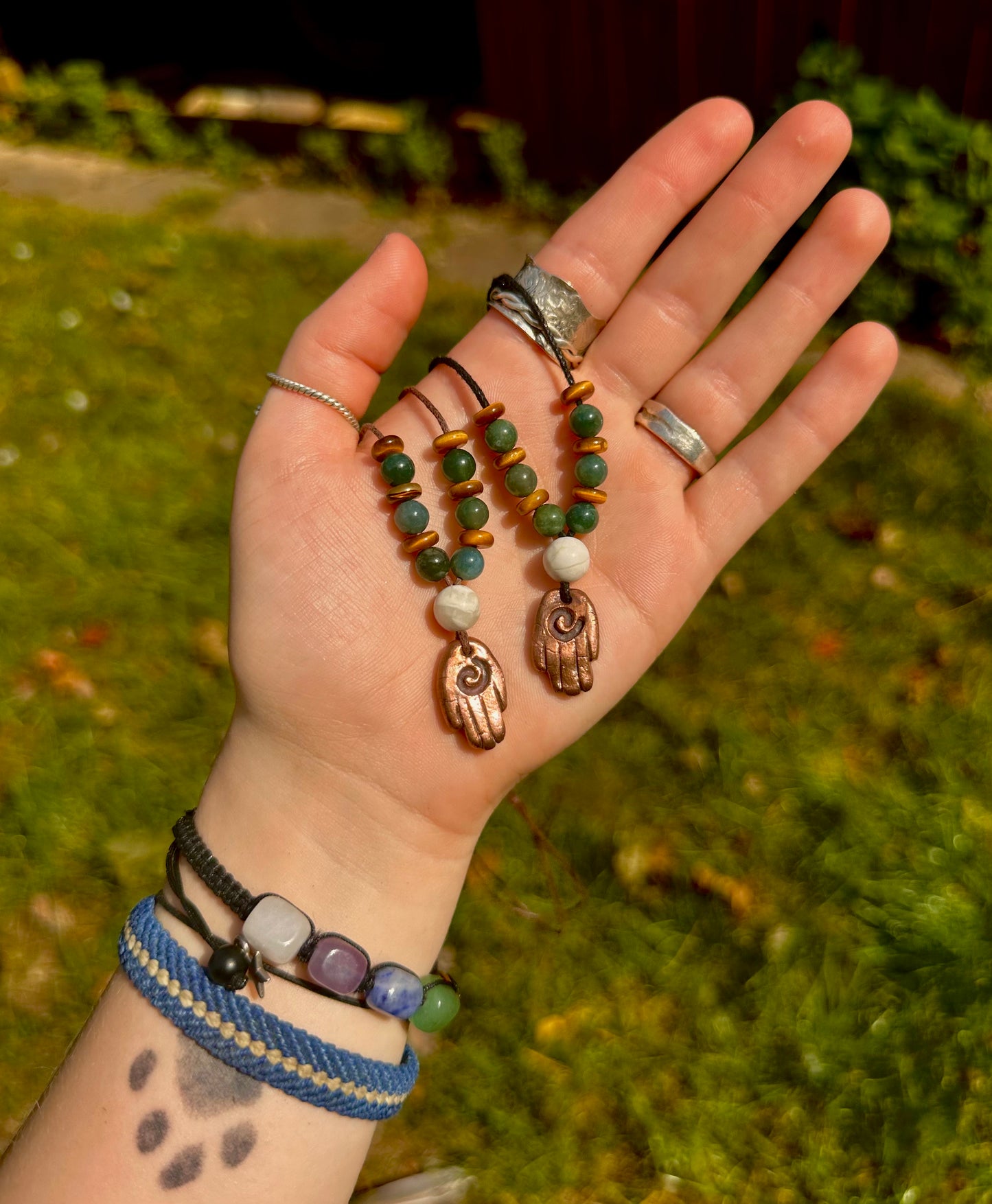 Large Copper Healing Hand pendant necklace with crystal beads.