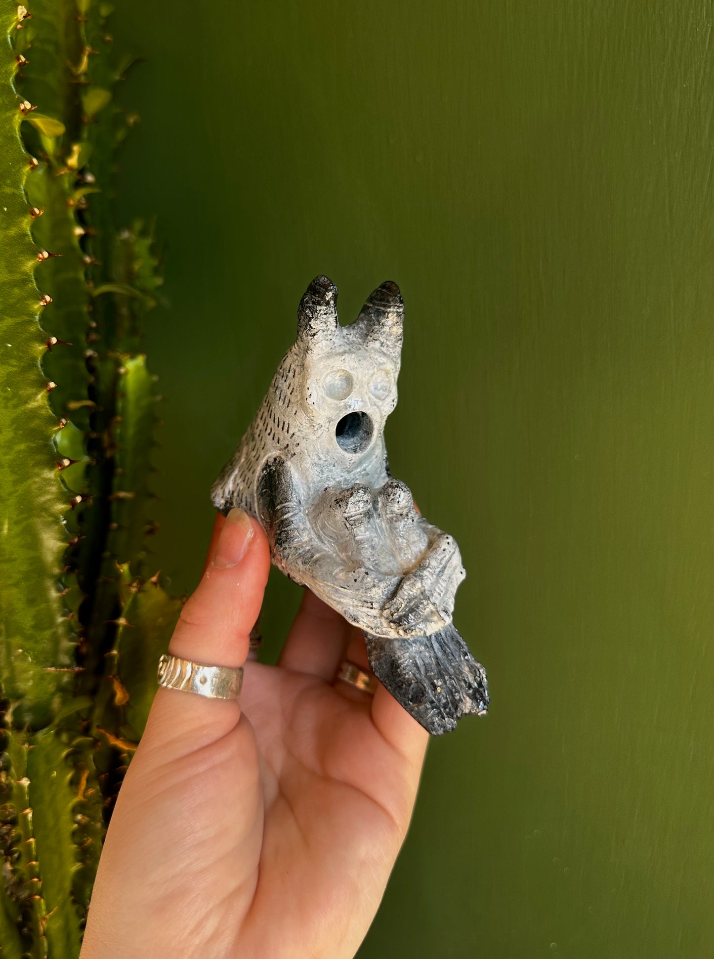 The pondering exhales, incense creature.